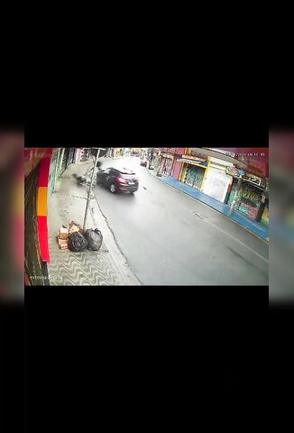 Car Misjudges Corner And Sends Oblivious Biker To The Hospital