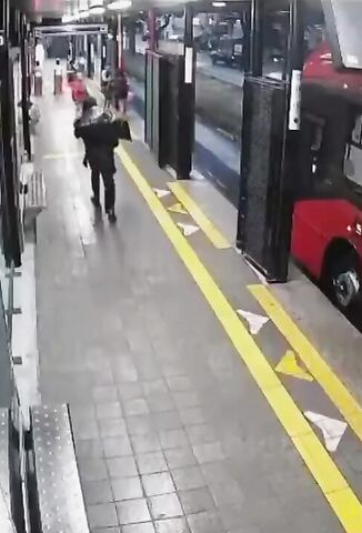 Homeless Man Arguing With Female Police Officer Pushes Her In Front Of An Oncoming Bus