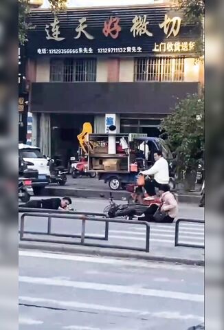 Man Trying To Read His Phone With His Eyes Hanging Out After Bike Accident