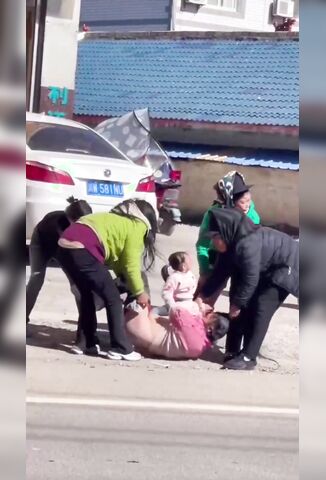 Mother Stripped And Punished On The Street In Front Of Her Kids