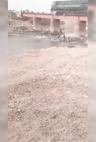 Bikers Use A Railway Bridge To Cross The River After Road Closure