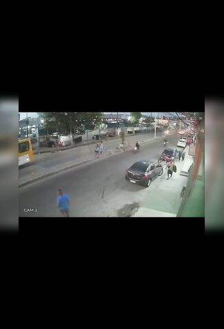 Biker Doing A Wheelie Smashes Into Pedestrians Crossing The Street