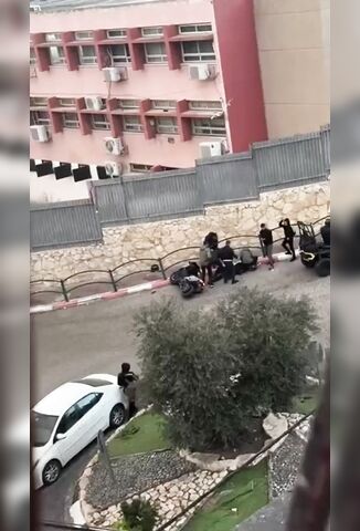 Tending To An Injured Biker In The West Bank