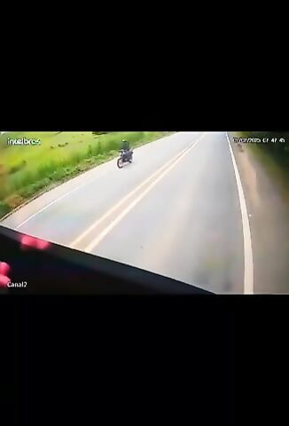 Biker Plays Chicken With An Oncoming Truck