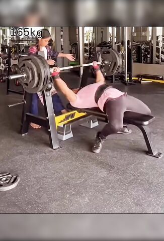 Female Spotter In Action For A 165 KG Press