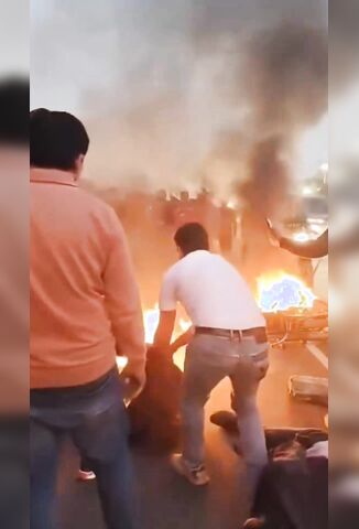 Crowd Attempt To Extinguish Biker On Fire After Crash