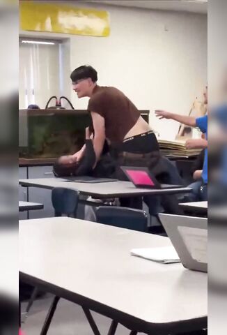 Guy Uses A Classroom Desk To Knock A Girl Out