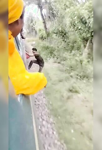 Man Trying TO Run With The Train Should Have Just Let Go.