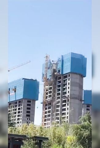 Workers Come Tumbling Down When Building Collapses