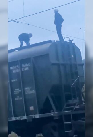 Two Messing On Top Of A Train Meet Electricity