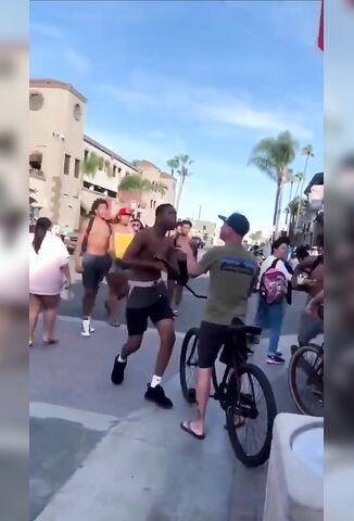 White Guy Saying Fuck You To A Bunch of Black Guys Riding Past