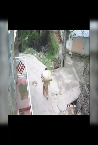 Biker Flies Off Cliff Side With His Arms Raised