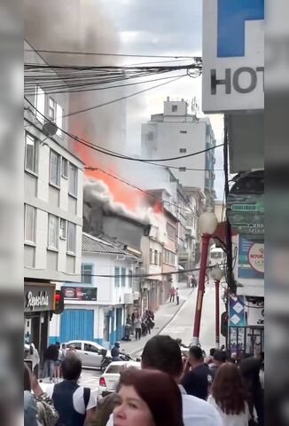Casually Watching A Building On Fire Above You