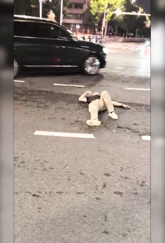 Drunk Guy Laying In The Road Gets Woken Up
