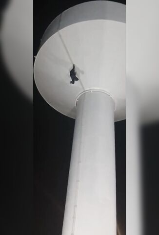 Crazy Man Climbing A Water Tower Falls
