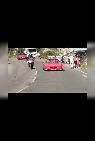 Biker Tries To Out Do A Ferrari Driver