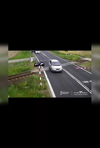 Driver Freezes After Hitting The Train Barriers