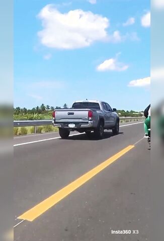 Pickup Truck Barges Female Biker Off The Road