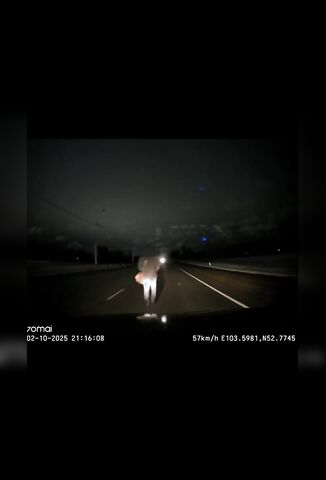 Pedestrian Uses The Road As A Sidewalk