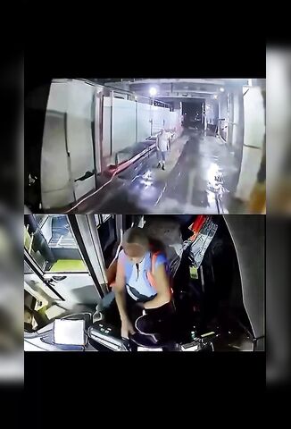 Female Bus Driver Entering The Bus Wash After Her Shift