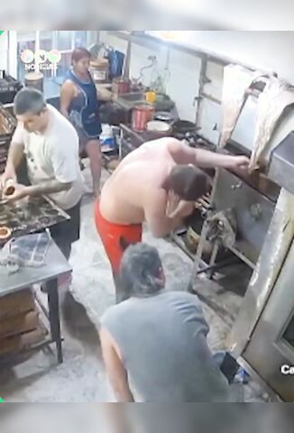 Men At Work Fixing The Oven