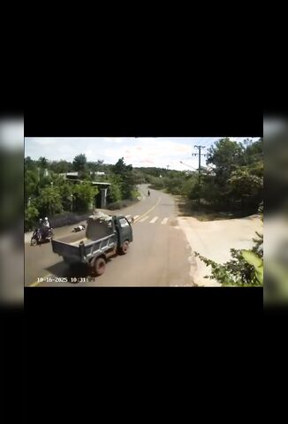 Cyclist Tries To Outrun An Open Bed Truck Crossing The Street