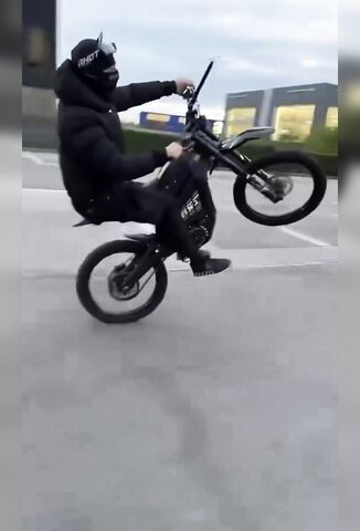 Nitty On An E Bike Wheelies Into Oncoming Car