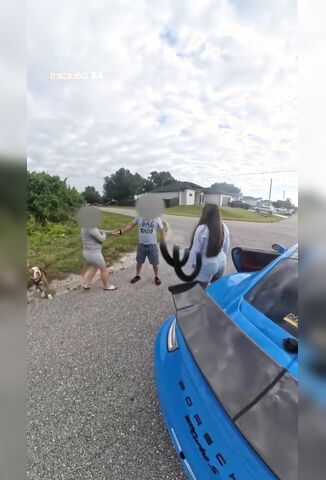 Bitch Trying To Launch Control Her Rented Car Points Gun At Neighbour For Being In The Road