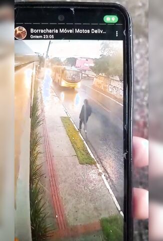Depressed Man Casually Lays Down Under A Passing Bus