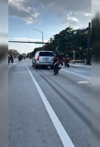 Bro Scrapes His Harley Into The Back Of A Waiting Minivan
