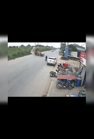 Heavy Plant Driver Loses Control And Veers Into Oncoming Biker