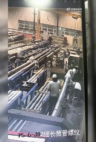 Worker Walks Too Close To A Spinning Lathe With Loose Clothes