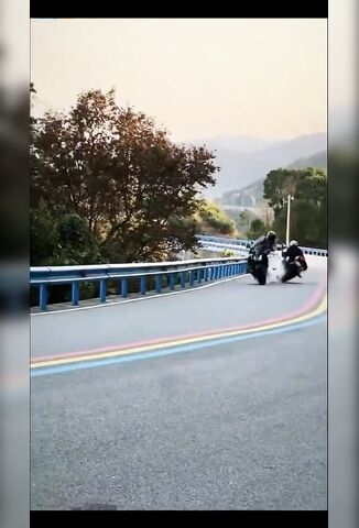 Asshole Gets His Knee Down Straight Into Another Biker