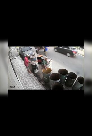 Bored Men Try To Look Inside Fuel Barrels With A Lighter