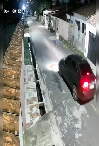 Man Walking Down The Road Shot By Passing Car