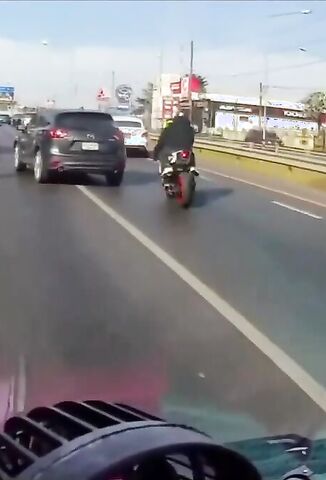 Biker Smashes Into The Back Of Stationary Traffic