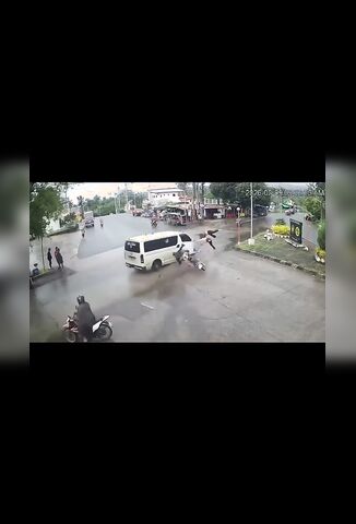 Three Up On A Bike Crossing The Junction
