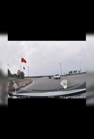 Idiot Biker Going The Wrong Way Around The Roundabout
