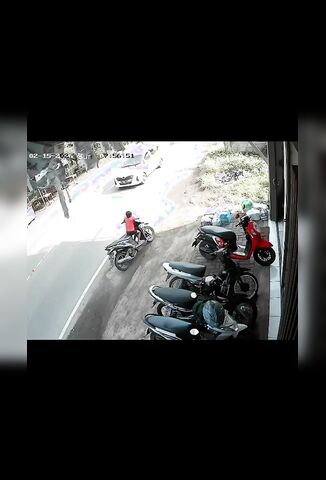 Parents Leave Their  Sitting On A Bike At the Side Of The Road