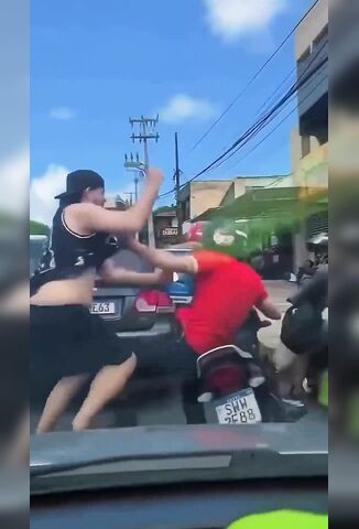 Mass Brawl On The Streets Provides Entertainment For Guy In The Car