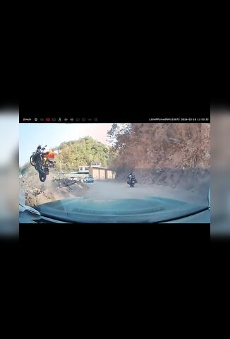 Female Biker Launches Off The Side Of A Cliff