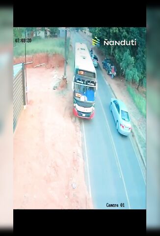 Biker Clips Car Falls Under Oncoming Bus