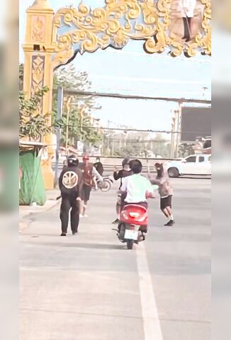 Man On A Scooter Joins In the Fight Knocks Himself Clean Out
