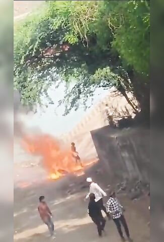 Biker Catches Fire And Stands Next To His Exploding Motorcycle